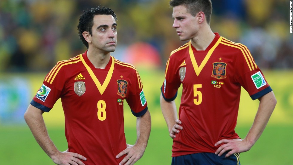 Spain&#39;s Xavi and Cesar Azpilicueta of Spain appear dejected in defeat.