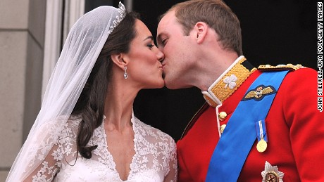 William and Catherine kiss on the balcony of Buckingham Palace after their wedding ceremony in London in 2011.  