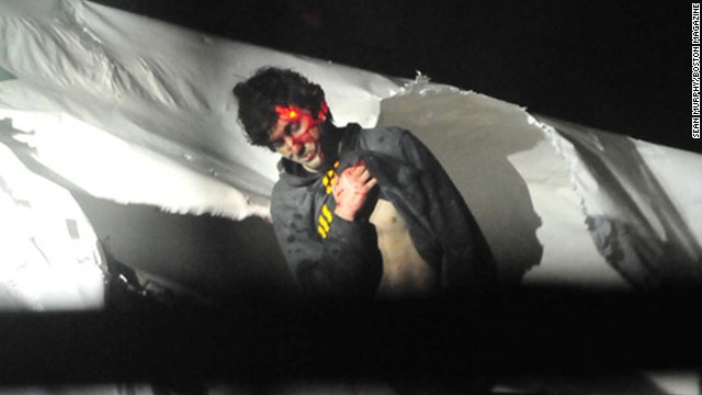 Photos of Boston Bombing Suspect Tsarnaev as he was captured on a boat