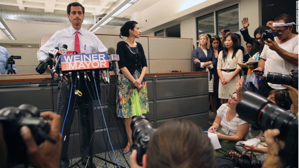 Huma Abedin stood beside her husband, Anthony Weiner, on Tuesday, July 23, as he once again addressed issues surrounding sending explicit messages over the Internet.  At times she smiled, other times she appeared solemn, but her message was clear: She is standing by her husband.  Abedin has worked for former Secretary of State Hillary Clinton for more than a decade, and while she&#39;s known for shying away from the spotlight, she can often be seen just offstage. 