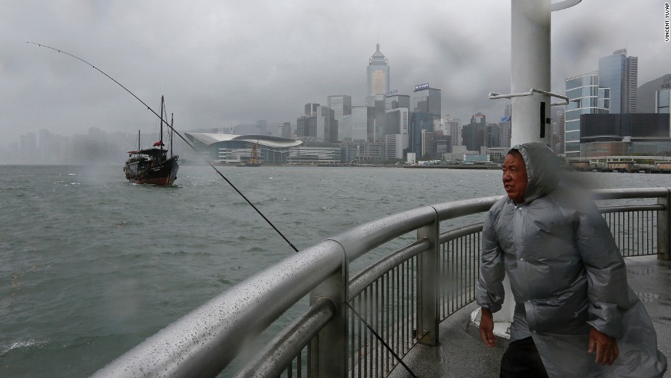 A fisherman battles a strong wind at Hong Kong's Victoria Habour on August 13. Typhoon Utor intensified as it moved toward the southern coast of China. The storm <a href="http://www.cnn.com/2013/08/12/world/asia/typhoon-utor/index.html">battered the northern Philippines</a> on Monday, killing at least one person and leaving 20 fishermen missing.