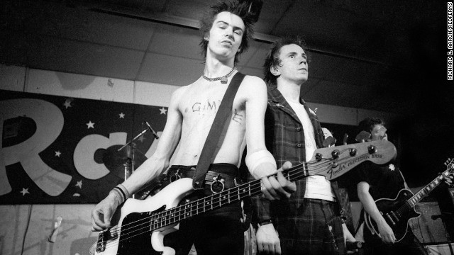 UNITED STATES - JANUARY 08:  Photo of SEX PISTOLS and Sid VICIOUS and Johnny ROTTEN; Sid Vicious, with Gimme a fix carved in to his chest, and Johnny Rotten (John Lydon) performing on stage at Randy&#39;s Rodeo Nightclub on their final tour  (Photo by Richard E. Aaron/Redferns)