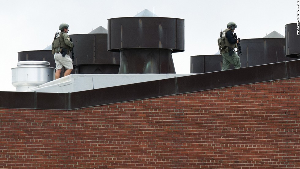Police officers walk on a rooftop at the Washington Navy Yard after a &lt;a href=&quot;http://www.cnn.com/2013/09/16/us/dc-navy-yard-gunshots/index.html&quot;&gt;shooting rampage&lt;/a&gt; in the nation&#39;s capital in September 2013. At least 12 people and suspect Aaron Alexis were killed, according to authorities.