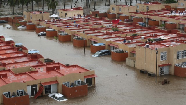 Homes and streets are seen flooded by the heavy rain brought on by tropical storms Ingrid and Manuel are seen on September 17 in Acapulco.  