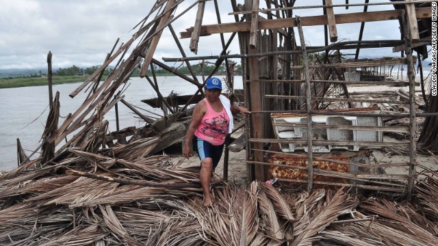 A resident of Barra de Coyuca checks the destruction in a restaurant by the beach in a tourist resort close to Acapulco, Guerrero state, Mexico  on September 19, 2013 as heavy rains hit the country. Deaths from floods and landslides battering Mexico neared 100 on Thursday as a fresh hurricane hit the northwest and rescuers faced a risky mission in a village buried in mud. AFP PHOTO/ Claudio VARGAS        (Photo credit should read CLAUDIO VARGAS/AFP/Getty Images)