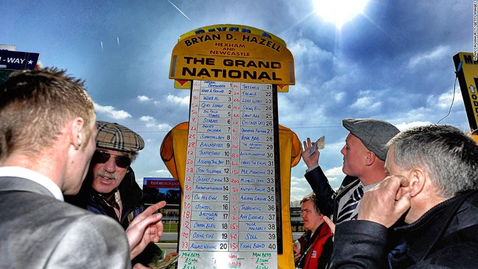 <strong>The Grand National, Aintree, Liverpool, UK: </strong>A bookmaker taking bets on the Grand National in April. The first official running of the world's most famous handicap steeplechase took place in 1839.