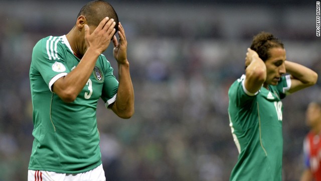 Carlos Salcido (L) and Andres Guardado of Mexico reacts after missing a goal during their FIFA World Cup Brazil 2014 qualifier football match against Costa Rica at the Azteca stadium in Mexico City on June 11, 2013. The game ended 0-0. AFP PHOTO/OMAR TORRES (Photo credit should read OMAR TORRES/AFP/Getty Images)