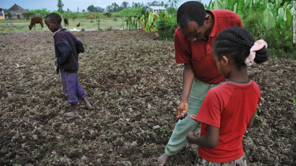 A farmer and his children plant a field with bean seeds and fertilizer in southern Ethiopia in 2008, a year after severe floods destroyed most of the food crop. Ethiopia is the country 10th most vulnerable to climate change effects, &lt;a href=&quot;http://www.cnn.com/2013/10/29/world/climate-change-vulnerability-index/index.html&quot;&gt;according to a 2013 report by Maplecroft&lt;/a&gt;.
