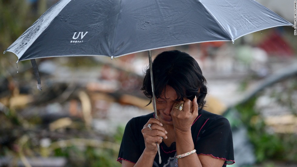 A woman mourns in front of her husband&#39;s dead body November 10 in Tacloban.