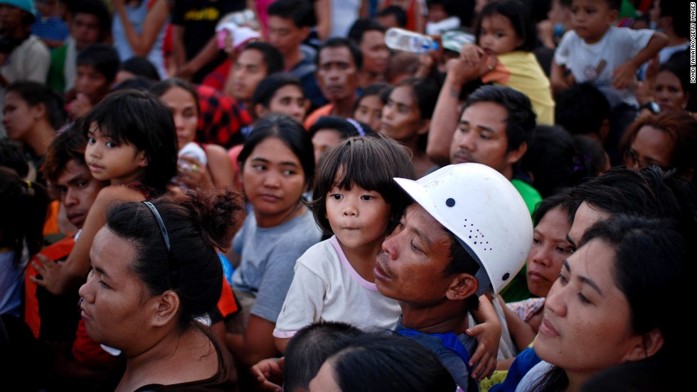 Evacuees wait to board a military aircraft in Leyte on Tuesday, November 12.