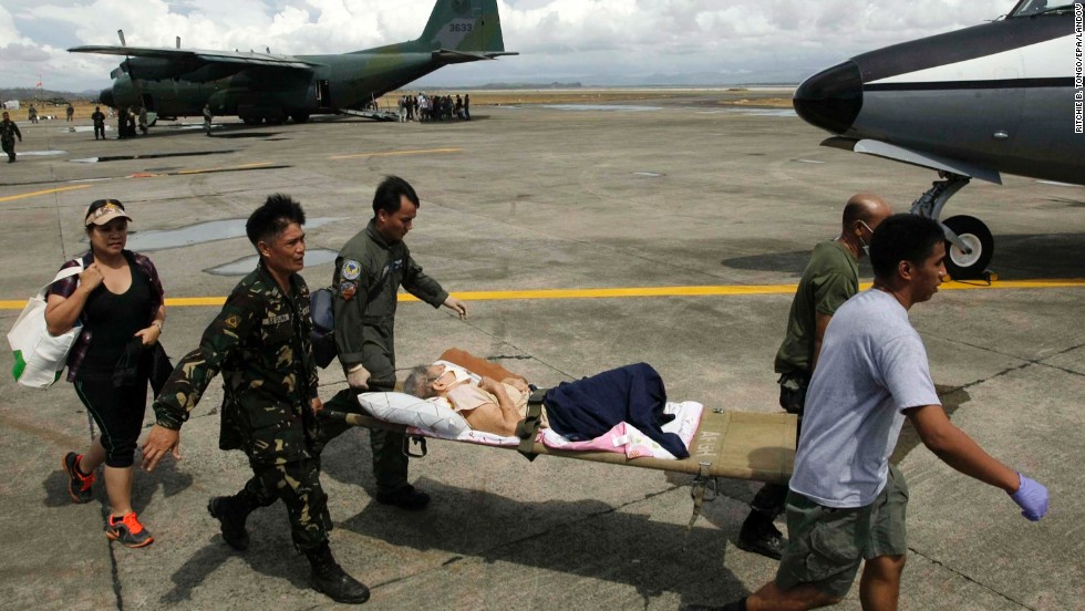 Soldiers transport a sick survivor November 13 in Tacloban.