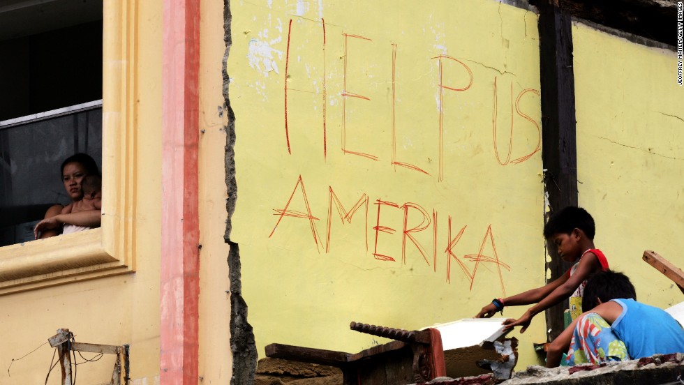 Survivors appeal for U.S. help November 16 in Tacloban.