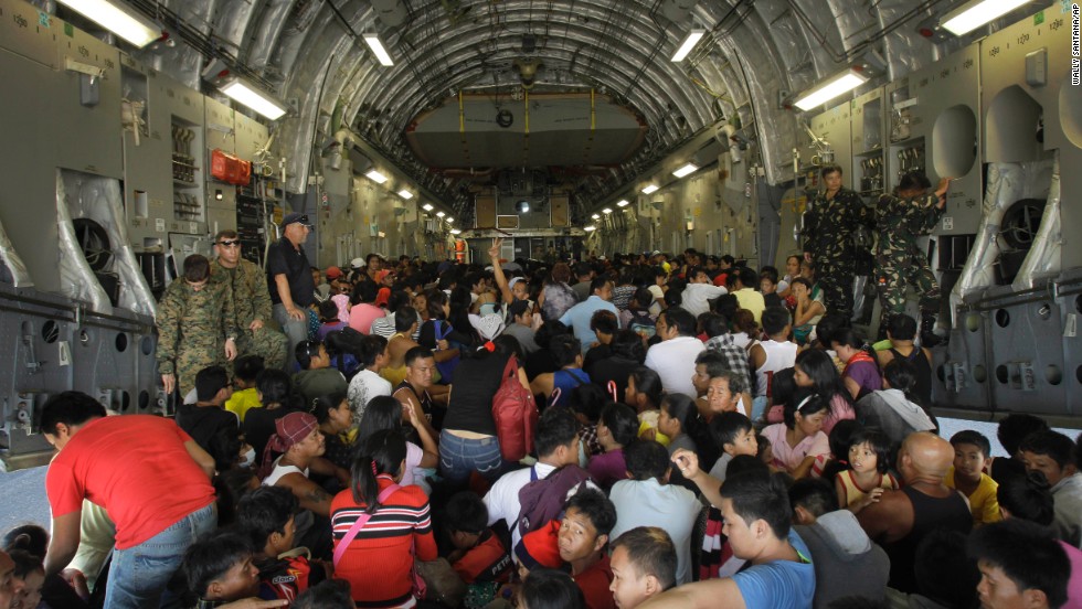 Hundreds of typhoon survivors are packed into a U.S. military airplane November 18 for evacuation from Tacloban&#39;s airport.