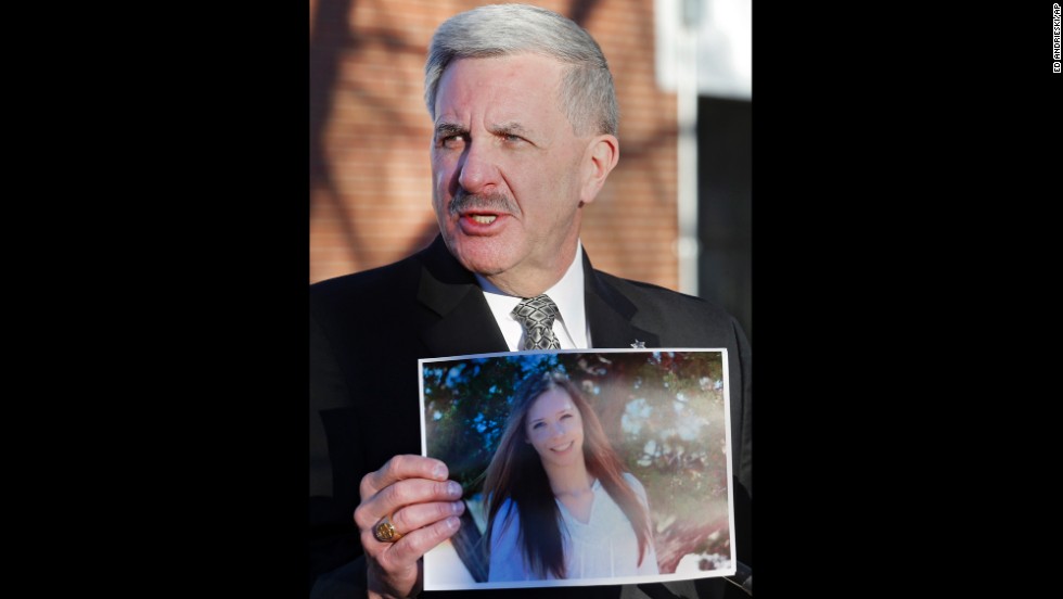 Arapahoe County Sheriff Grayson Robinson holds a picture of Davis at a press conference on Saturday, December 14, after identifying her as the victim of the shooting at Arapahoe High School the day before.