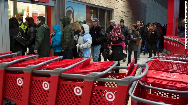 Shoppers enter a Target store in Dartmouth, Nova Scotia, on Friday, Nov. 29, 2013. Black Friday, thought to be the most important shopping day of the year in the United States, is having an impact on Canadian sales as retailers work to keep consumers home, north of the border. 