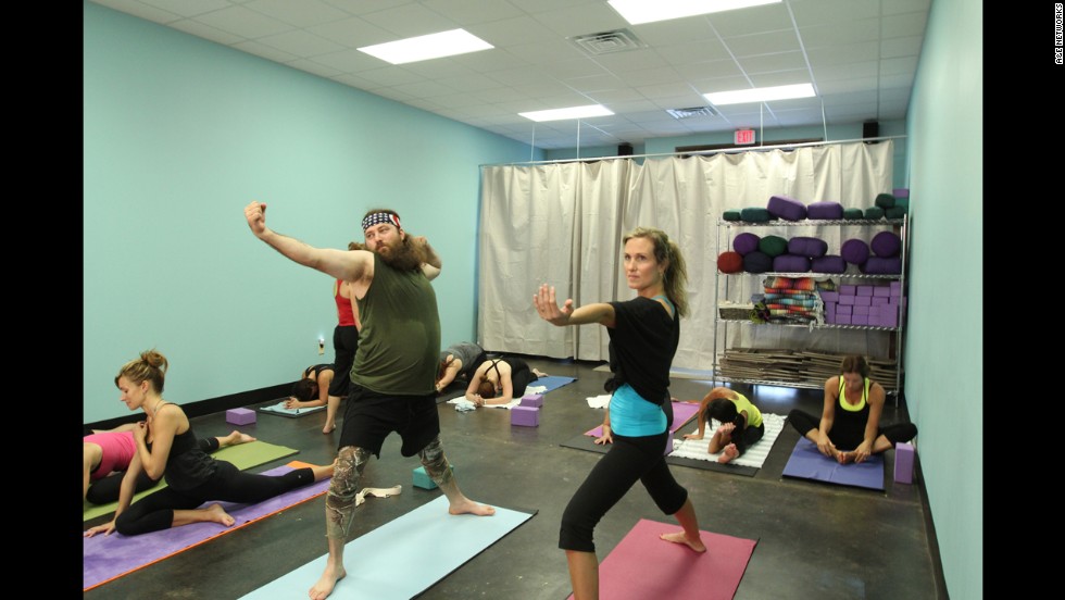 Willie Robertson, one of Phil&#39;s sons, does yoga with his wife, Korie, to get ready for their high school reunion. Willie does much of the narrating on the show.
