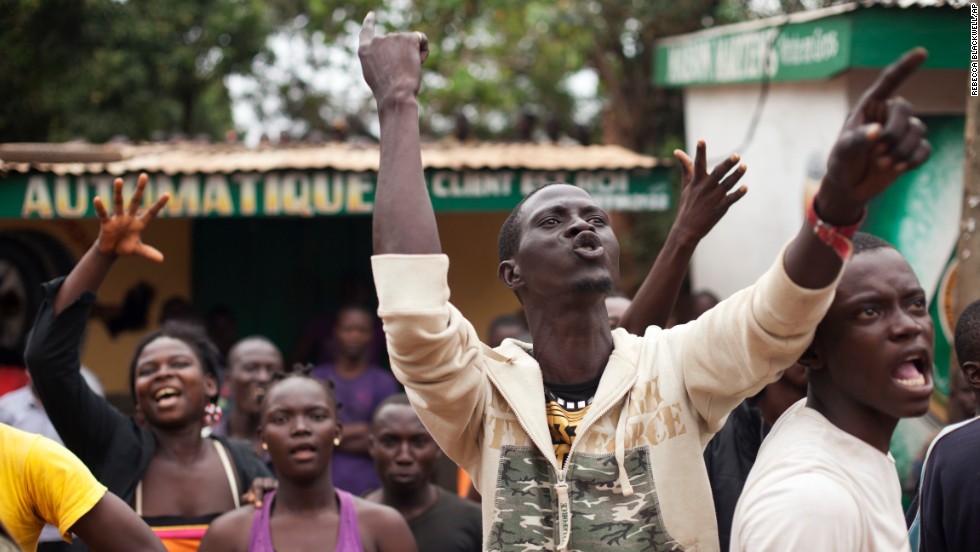 Angry Christians shout at a truck of fleeing Muslims in the Gobongo neighborhood of Bangui on Friday, December 27.