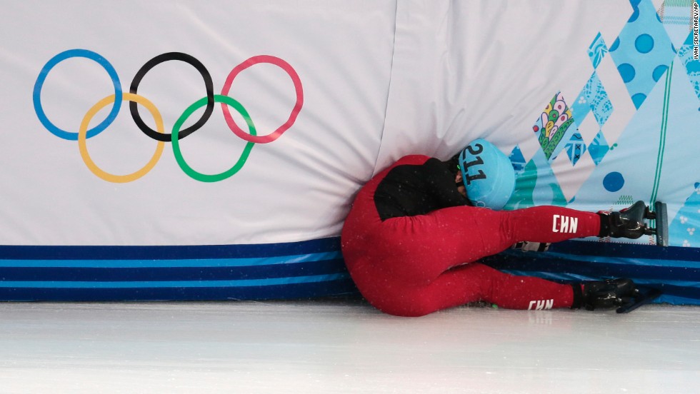 Speedskater Shi Jingnan of China crashes in a men's 1,500-meter short track race on February 10.