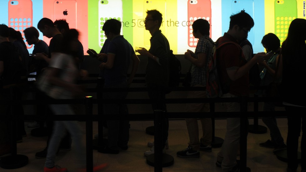 Apple broadened the acceptance of fingerprint scanning with the iPhone 5S&#39; Touch ID sensor. In this picture, people queue outside an Apple store to purchase the new iPhone 5S and 5C in Hong Kong on September 20, 2013.