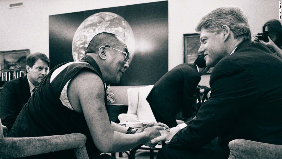 President Bill Clinton talks with the Dalai Lama as Vice President Al Gore looks on during a meeting at the White House in April 1994.