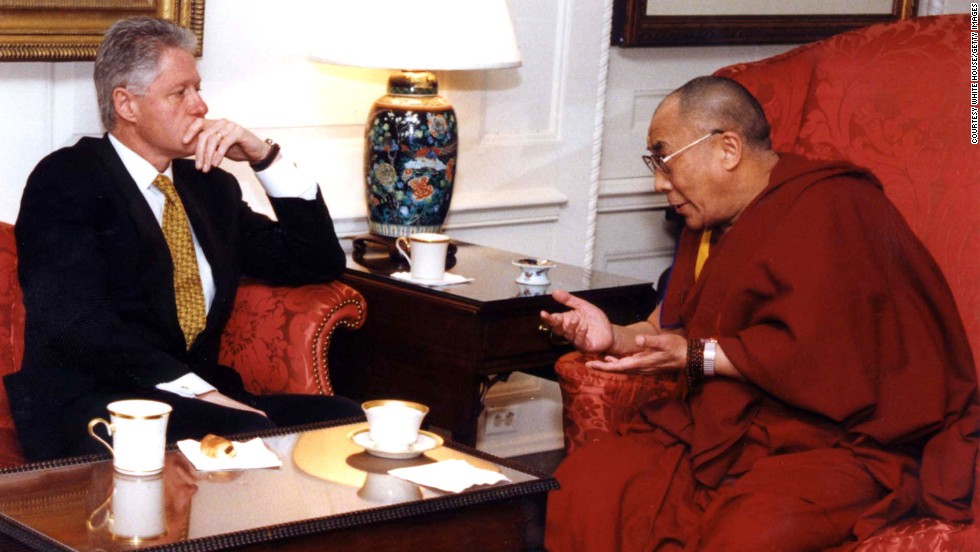 President Bill Clinton listens to the Dalai Lama during a meeting in November 1998 at the White House.