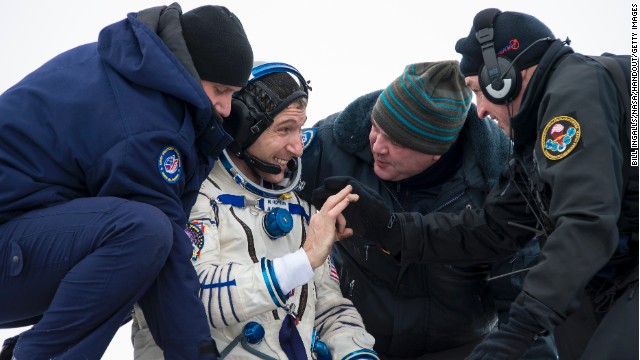 NASA&#39;s Mike Hopkins grins as he&#39;s helped from the Soyuz capsule near Zhezkazgan, Kazakhstan, on Tuesday.