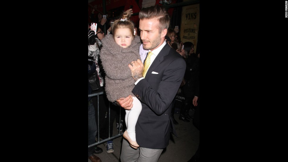 Beckham and his daughter, Harper, make their way through a crowd in New York in February. Harper, Beckham&#39;s fourth child, was born in 2011. 
