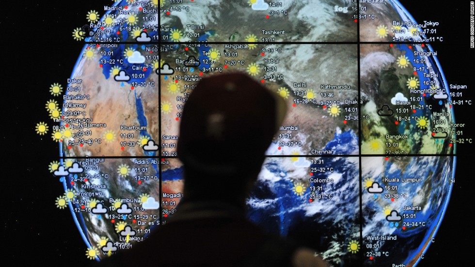 A passenger views a weather map in the departures terminal of Kuala Lumpur International Airport on March 22, 2014.