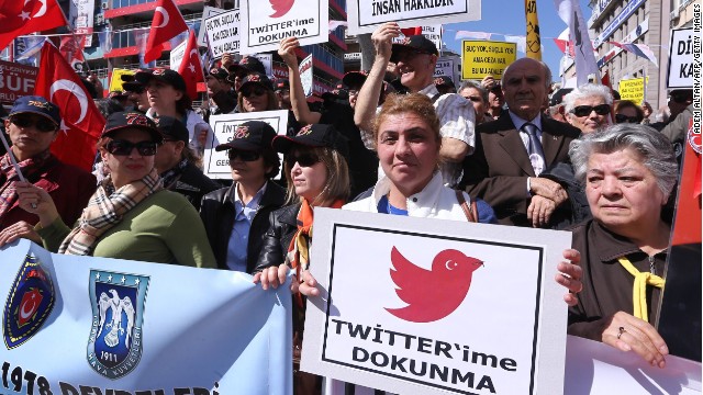 Protesters hold placards reading 'Do not touch my Twitter ' during a demonstration against the Turkish government's Twitter ban in Ankara on March 22, 2014.