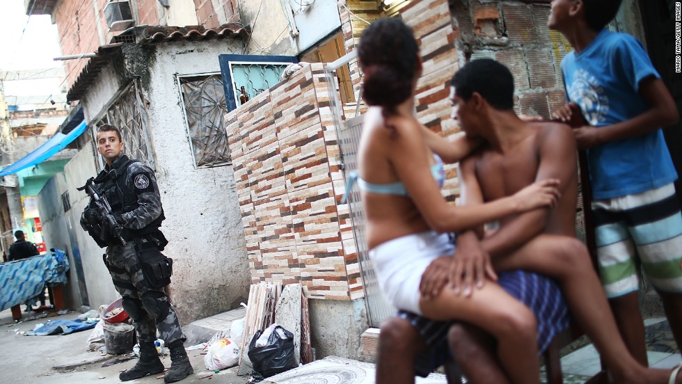 A military police officer stands guard at Complexo da Mare, one of the largest favela complexes in Rio de Janeiro, on Sunday, March 30. The Brazilian government has deployed federal forces to violence-plagued slums ahead of the FIFA World Cup, which starts in June.