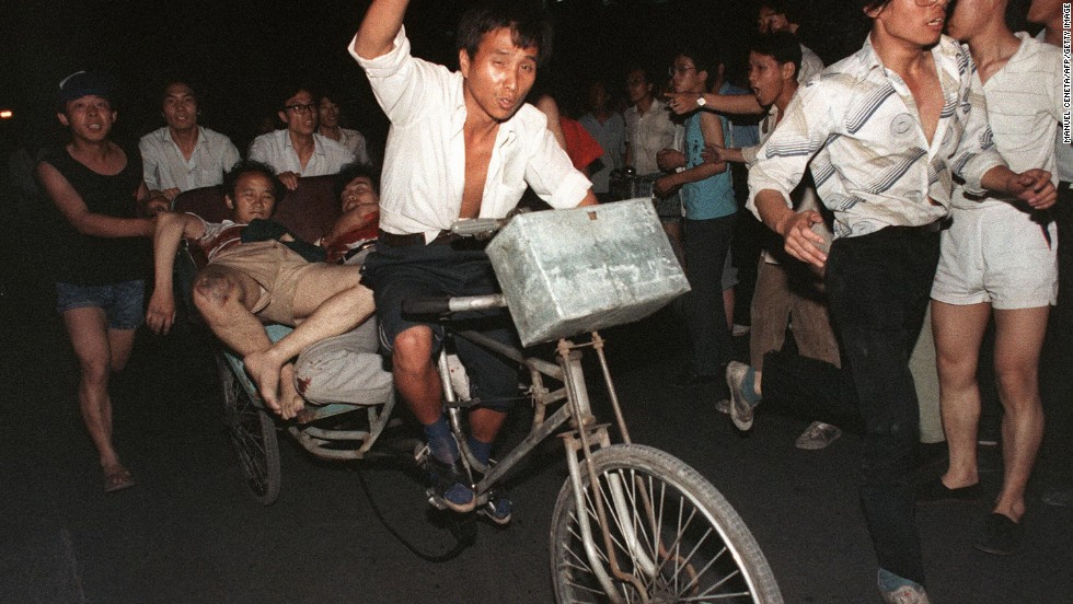 On the night of June 3 and into the early hours of June 4, armed troops and tanks moved in on students and other civilians in the areas around Tiananmen Square, opening fire on the crowds. 