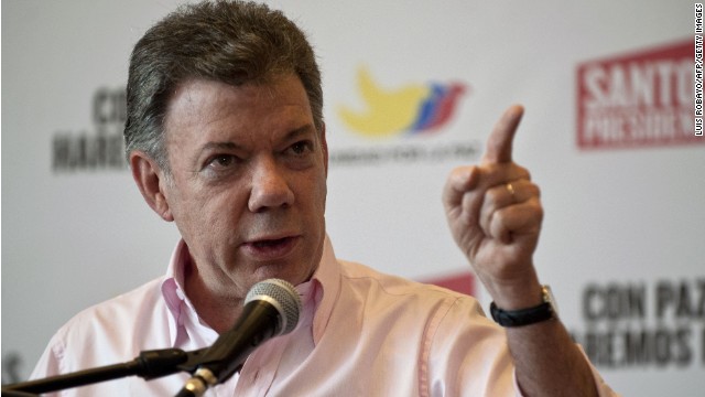 Colombian president and presidential candidate Juan Manuel Santos speaks during a press conference in Cali, Colombia, on May 31, 2014. Santos will face presidential candidate for the Democratic Center party Oscar Ivan Zuluaga in the presidential run-off on June 15. 