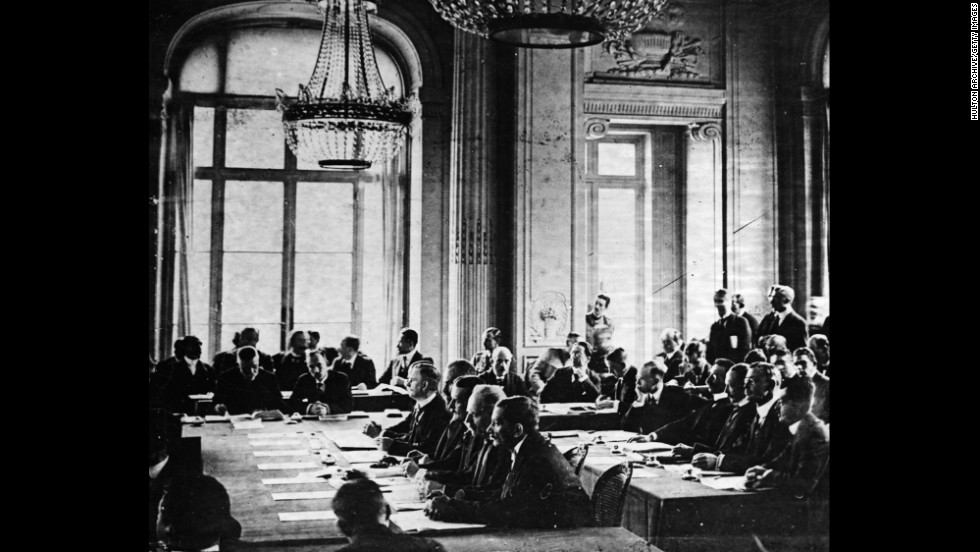 German delegates listen to French Prime Minister Georges Clemenceau&#39;s speech during the signing of the Treaty of Versailles in France on June 28, 1919.