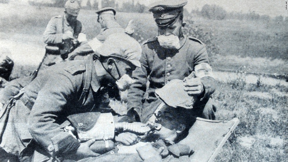 Germans give oxygen to a gas victim in 1915. The cloth masks worn by these soldiers provided little defense; more substantial gas masks were not produced until 1916. By the end of the war, even horses and dogs used at the front had their own gas masks. 