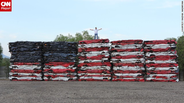 Talk about patriotism, Razmik Nazaryan made this colossal American flag rendition with 108 crushed cars. The artist works in auto recycling and was inspired to create his masterpiece back in July 2013.