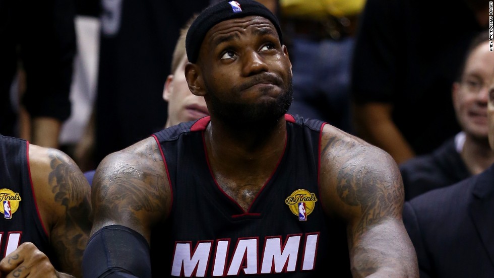 James reacts on the bench during the NBA Finals in June 2014. Later that month, he became a free agent.