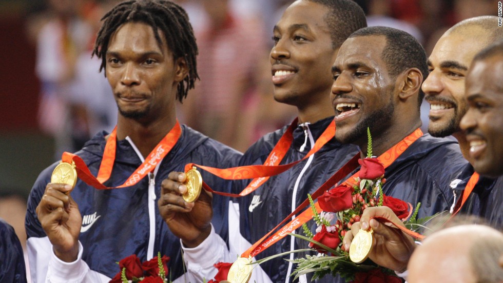 U.S. basketball players receive their gold medals after they defeated Spain at the 2008 Summer Olympics in Beijing. From left are Chris Bosh, Dwight Howard, James, Carlos Boozer and Michael Redd. James would also win a gold medal on the 2012 Olympic team.