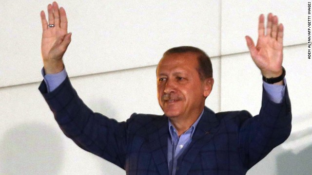 Newly elected Turkish president Recep Tayyip Erdogan waves at supporters from the balcony of the AKP party headquarters during the celebrations of his victory in the presidential election vote in Ankara on August 10, 2014.