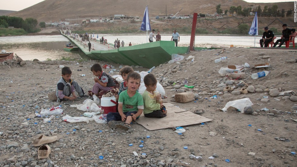 Children rest after arriving back into Kurdish-controlled Iraq.