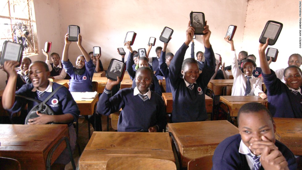 Academy students show off their Kindle e-readers. "The Kindle is very important," said Abdul Kassim, the school's founder and executive director. "It means their life."