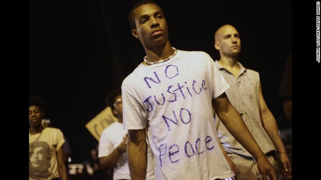 Demonstrators protest in Ferguson on August 20.