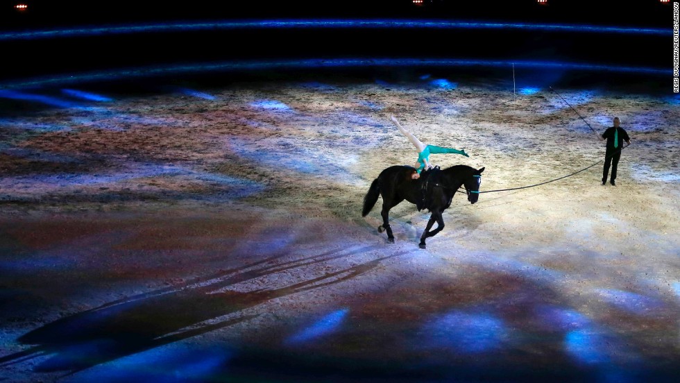 A rider and artist perform during the opening ceremony of the World Equestrian Games in Caen, France, on Saturday, August 23.