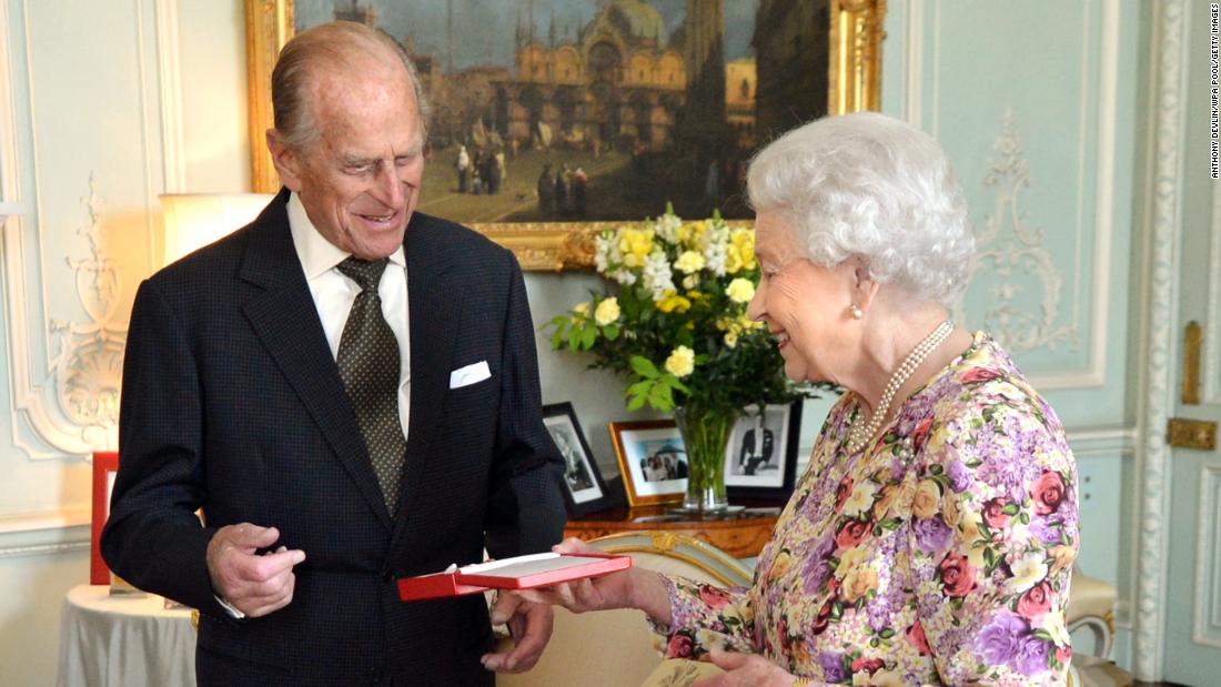 The Queen presents Prince Philip with New Zealand&#39;s highest honor, the Order of New Zealand, at Buckingham Palace in June 2013.