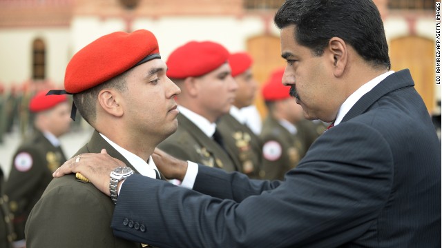 Venezuelan President Nicolas Maduro (R) attends a military promotion ceremony in Caracas on July 1, 2014. AFP PHOTO/Leo RAMIREZ (Photo credit should read LEO RAMIREZ/AFP/Getty Images)