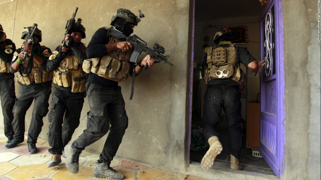 Iraqi special forces search a house in Jurf al-Sakhar, Iraq, on Thursday, October 30, after retaking the area from ISIS.