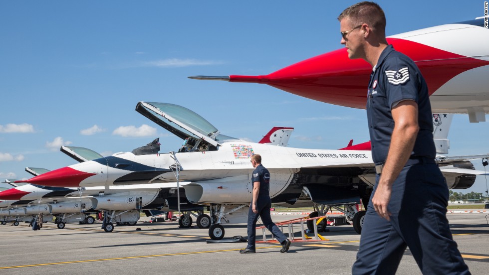 The Thunderbirds team keeps eight F-16 airplanes ready on the flight line at Daytona Beach International Airport before the Embry-Riddle Aeronautical University&#39;s Wings and Waves Air Show.