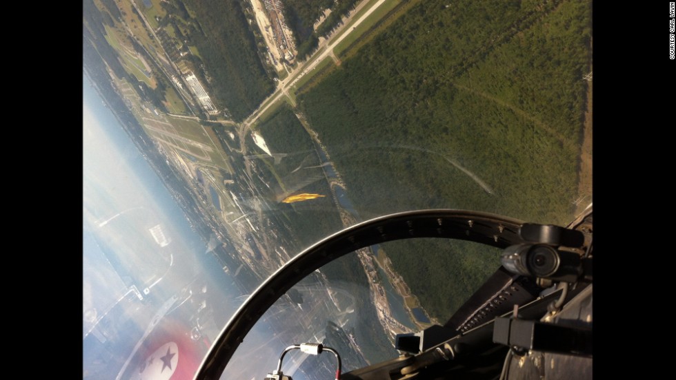 Sharp turns and unusual views of the horizon add to the thrills of a ride in a fighter jet. After an hour demonstration ride with the Thunderbirds, this was the scene through the canopy heading for a landing on runway 7-L at Daytona Beach, which is visible in the top left part of the frame.