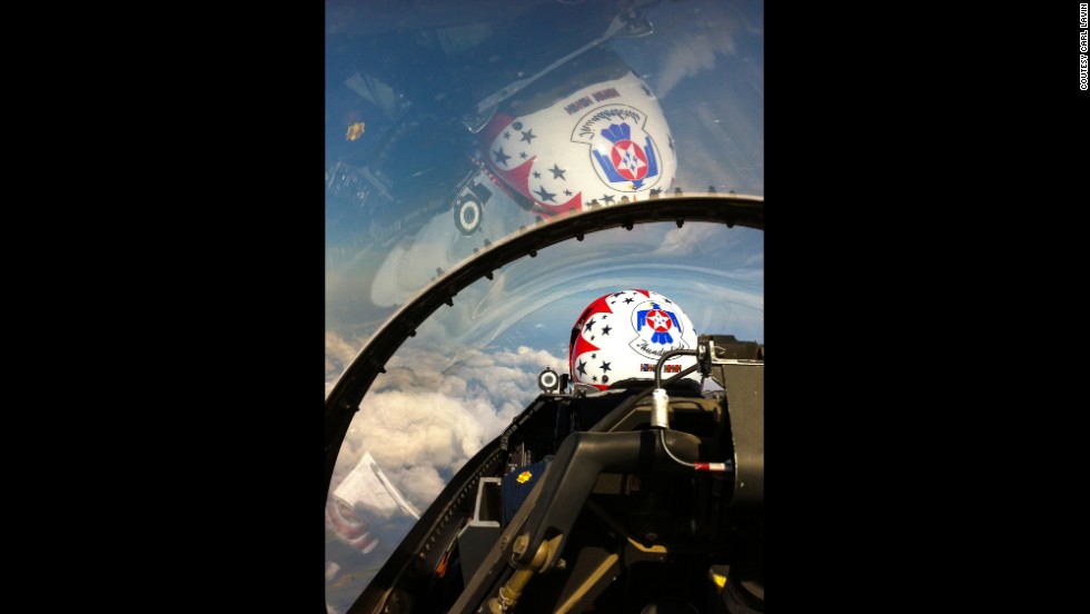 The bubble canopy on the Thunderbird F-16 covers the pilot, Maj. Michael Fisher, and the second seat area, where a passenger can almost reach ahead and tap the pilot on the shoulder. 
