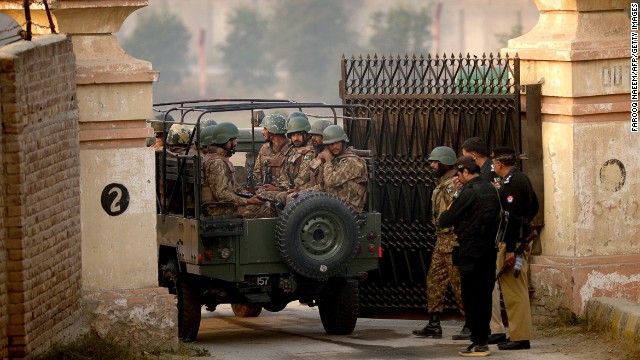 Pakistani army soldiers in a vehicle arrive at the gates of a school in Peshawar on December 17, 2014, the day after an attack on the army school in the northern city. Pakistan has begun three days of mourning for the 132 schoolchildren and nine staff killed by the Taliban in the country&#39;s deadliest ever terror attack as the world united in a chorus of revulsion. The 141 people were killed when insurgents stormed an army-run school in the northwestern city of Peshawar on Tuesday and systematically went from room to room shooting children during an eight-hour killing spree. AFP PHOTO / Farooq NAEEM (Photo credit should read FAROOQ NAEEM/AFP/Getty Images)
