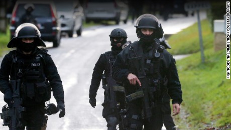 Members of GIPN and of RAID, French police special forces, are pictured in Corcy, near Villers-Cotterets, north-east of Paris, on January 8, 2015, where the two armed suspects from the attack on French satirical weekly newspaper Charlie Hebdo were spotted in a gray Clio. 